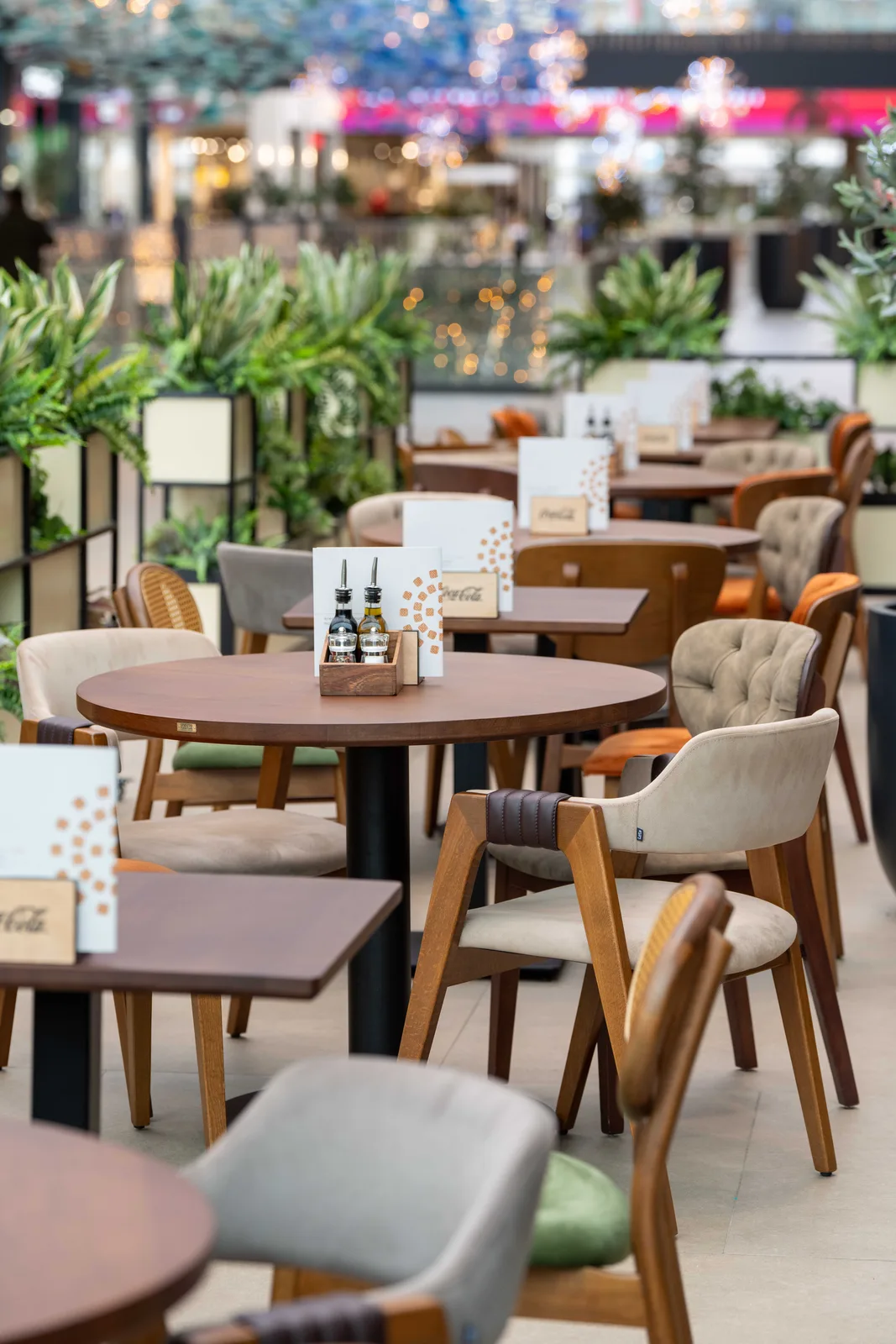 Monument restaurant in the Galerija mall — solid wood tables and chairs